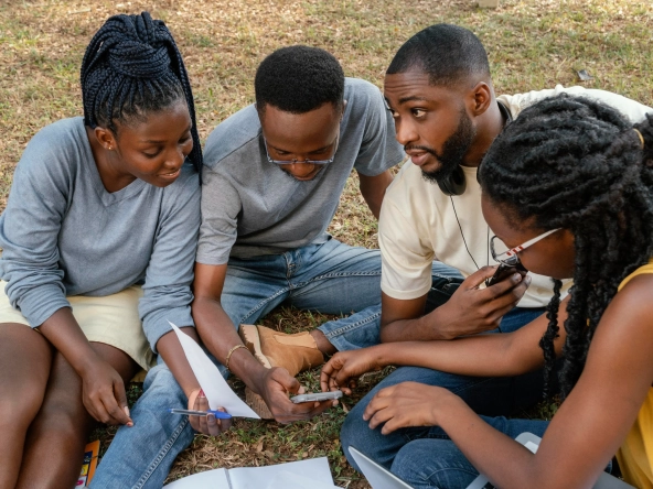 Group discussing land maps or plans