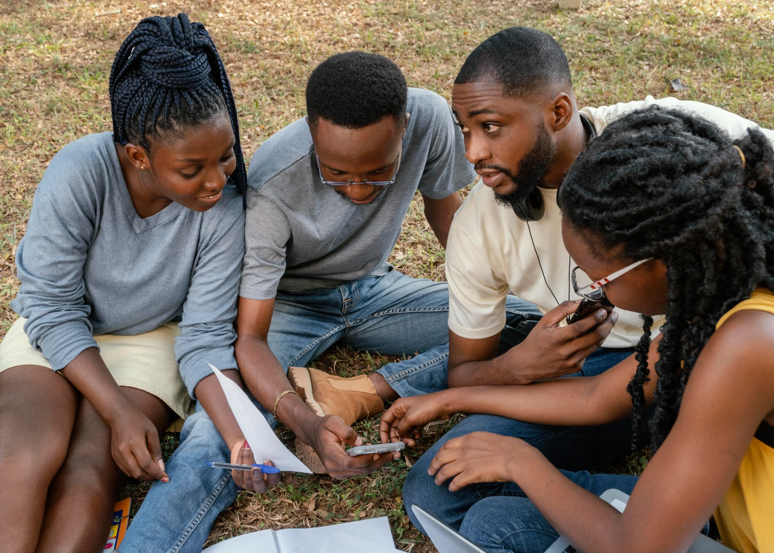 Group discussing land maps or plans